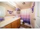 Clean bathroom with wooden vanity and purple accents at 57 Sebring Ct, Whiteland, IN 46184