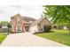 Two-story brick house with attached garage and large yard at 57 Sebring Ct, Whiteland, IN 46184