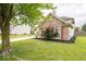 Brick home with red shutters and a well-manicured lawn at 57 Sebring Ct, Whiteland, IN 46184