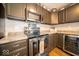 Kitchen boasting stainless steel appliances and granite countertops at 57 Sebring Ct, Whiteland, IN 46184