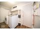 Laundry room with washer, dryer, shelving and built-in storage at 57 Sebring Ct, Whiteland, IN 46184