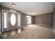 Spacious living room with neutral walls and carpeted floors at 57 Sebring Ct, Whiteland, IN 46184