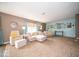 Cozy living room with light beige sectional sofa and accent chairs at 57 Sebring Ct, Whiteland, IN 46184
