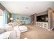 Living room with large TV and built-in entertainment center at 57 Sebring Ct, Whiteland, IN 46184
