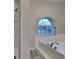 Updated bathroom with soaking tub, shower, and modern fixtures at 5939 Brendonridge S Ct, Indianapolis, IN 46226