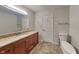 Bathroom with granite vanity and tile floor at 5939 Brendonridge S Ct, Indianapolis, IN 46226