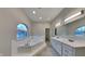 Bathroom with double vanity and soaking tub at 5939 Brendonridge S Ct, Indianapolis, IN 46226