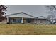 Ranch home with covered porch and landscaped yard at 5939 Brendonridge S Ct, Indianapolis, IN 46226