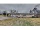 Ranch home with attached garage and manicured lawn at 5939 Brendonridge S Ct, Indianapolis, IN 46226