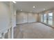 Spacious living room with carpeting and French doors at 5939 Brendonridge S Ct, Indianapolis, IN 46226