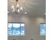 Bright living room with chandelier and large windows at 5939 Brendonridge S Ct, Indianapolis, IN 46226