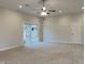 Main bedroom with ceiling fan and sliding glass door at 5939 Brendonridge S Ct, Indianapolis, IN 46226