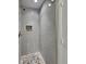 Shower with grey tile and pebble floor at 5939 Brendonridge S Ct, Indianapolis, IN 46226
