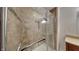 Large shower with tile surround and pebble floor at 5939 Brendonridge S Ct, Indianapolis, IN 46226