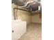 Unfinished basement features laundry area and exposed ceiling at 6639 N College Ave, Indianapolis, IN 46220