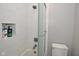 Updated bathroom with white tile, walk-in shower, and bathtub at 6639 N College Ave, Indianapolis, IN 46220