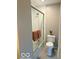 Bathroom featuring sliding glass door shower, white tile and toilet at 6639 N College Ave, Indianapolis, IN 46220