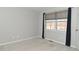 Spacious bedroom with neutral walls, carpeting, and window with curtains at 6639 N College Ave, Indianapolis, IN 46220