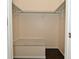 Empty closet with built-in shelves and a carpeted bench at 6639 N College Ave, Indianapolis, IN 46220
