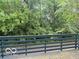 View from the deck overlooking lush greenery and a serene outdoor space at 6639 N College Ave, Indianapolis, IN 46220