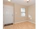 Bright entryway with door and window, leading to dining area at 6639 N College Ave, Indianapolis, IN 46220