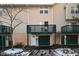 Tan colored townhome with a private deck and attached garage at 6639 N College Ave, Indianapolis, IN 46220