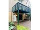 Two-story townhouse with attached garage, porch, and landscaped yard at 6639 N College Ave, Indianapolis, IN 46220