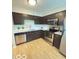 Kitchen featuring stainless steel appliances, sleek counter tops and dark cabinets at 6639 N College Ave, Indianapolis, IN 46220
