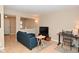 Open living space with sectional sofa, home office, and light flooring at 6639 N College Ave, Indianapolis, IN 46220