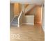 Staircase with neutral carpet in a home with hardwood floors and light colored walls at 6639 N College Ave, Indianapolis, IN 46220