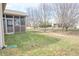 Landscaped backyard with trees and small yard at 7842 Cork Bend Ln, Indianapolis, IN 46239