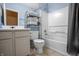 Clean bathroom, bathtub, toilet and vanity with storage at 7842 Cork Bend Ln, Indianapolis, IN 46239