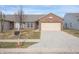 Brick ranch home with attached garage and driveway at 7842 Cork Bend Ln, Indianapolis, IN 46239