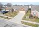 Aerial view of brick ranch home with attached garage and driveway at 7842 Cork Bend Ln, Indianapolis, IN 46239