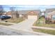 Aerial view of brick ranch home with attached garage and driveway at 7842 Cork Bend Ln, Indianapolis, IN 46239