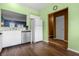 White kitchen cabinets, stainless steel appliances, and view to hallway at 7842 Cork Bend Ln, Indianapolis, IN 46239