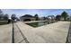 Community pool with a bathhouse and a concrete deck area at 7842 Cork Bend Ln, Indianapolis, IN 46239