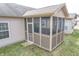 Screened porch with lattice details adjacent to the house at 7842 Cork Bend Ln, Indianapolis, IN 46239