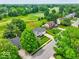 Aerial view of the property with a golf course and lush greenery around at 956 Dorchester Dr, Noblesville, IN 46062