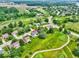 The residence sits amidst a meticulously manicured golf course community, captured from an aerial perspective at 956 Dorchester Dr, Noblesville, IN 46062