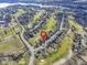 Wide aerial showcasing the property's location near a golf course and lake at 956 Dorchester Dr, Noblesville, IN 46062