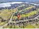 Property's location shown in an aerial view, near a golf course and lake at 956 Dorchester Dr, Noblesville, IN 46062