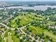 Breathtaking aerial view of a golf course community with a lake and winding roads at 956 Dorchester Dr, Noblesville, IN 46062
