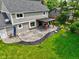 An aerial view showcases a patio area with a canopy, and fresh landscaping prep in the backyard at 956 Dorchester Dr, Noblesville, IN 46062