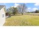 Spacious backyard with shed and partial view of a neighboring house at 956 Dorchester Dr, Noblesville, IN 46062