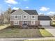 Two-story house with brick and siding, two-car garage, and landscaped lawn at 956 Dorchester Dr, Noblesville, IN 46062