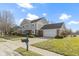 Two-story house with brick and siding, attached two-car garage, and a well-manicured lawn at 956 Dorchester Dr, Noblesville, IN 46062