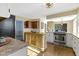 Open concept kitchen with island, stainless steel appliances, and hardwood floors at 956 Dorchester Dr, Noblesville, IN 46062