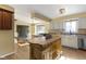 Open kitchen with island, stainless steel appliances, hardwood floors and breakfast bar at 956 Dorchester Dr, Noblesville, IN 46062