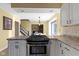 Kitchen with island, stainless steel appliances, and view to dining area at 956 Dorchester Dr, Noblesville, IN 46062